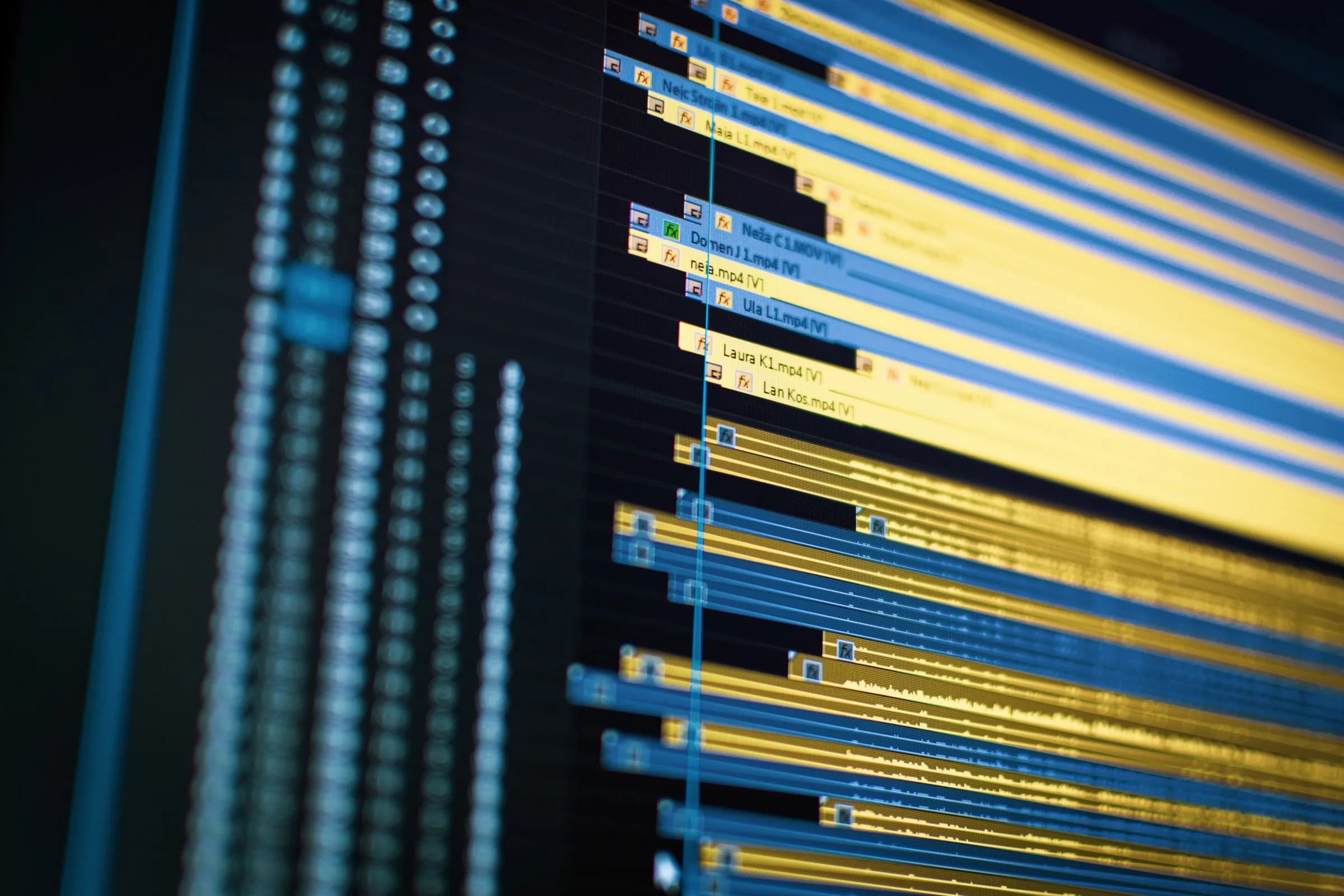 Close-up of a multi-track video editing timeline on screen, the editor-first workflow