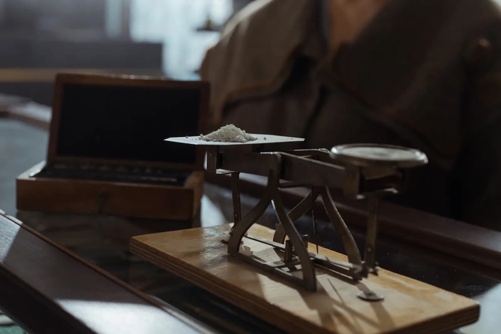 A balance scale on a dark surface, illustrating an honest weighing of strengths and limits