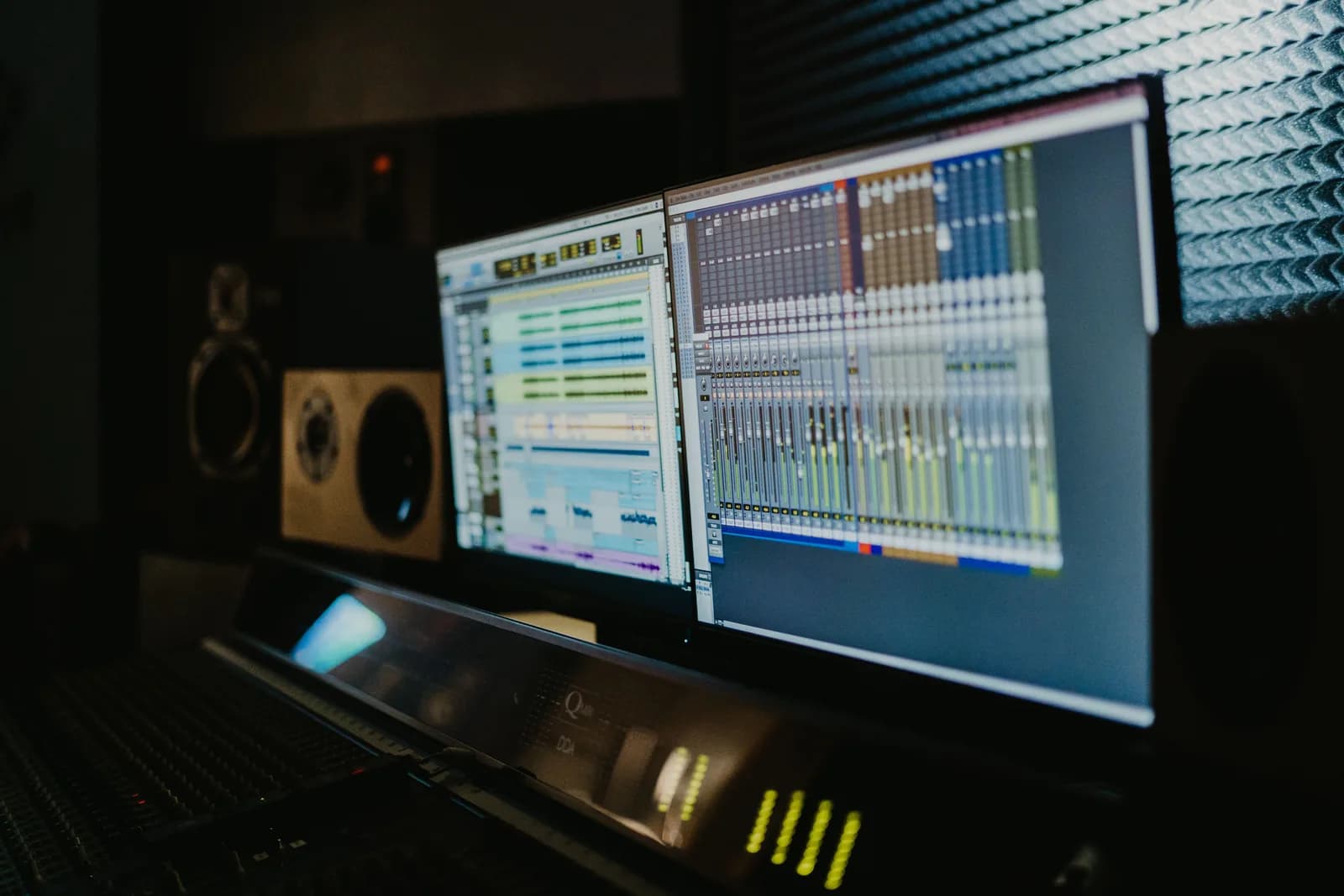 Close-up of an audio editing waveform on a dark monitor, illustrating speech measured for errors