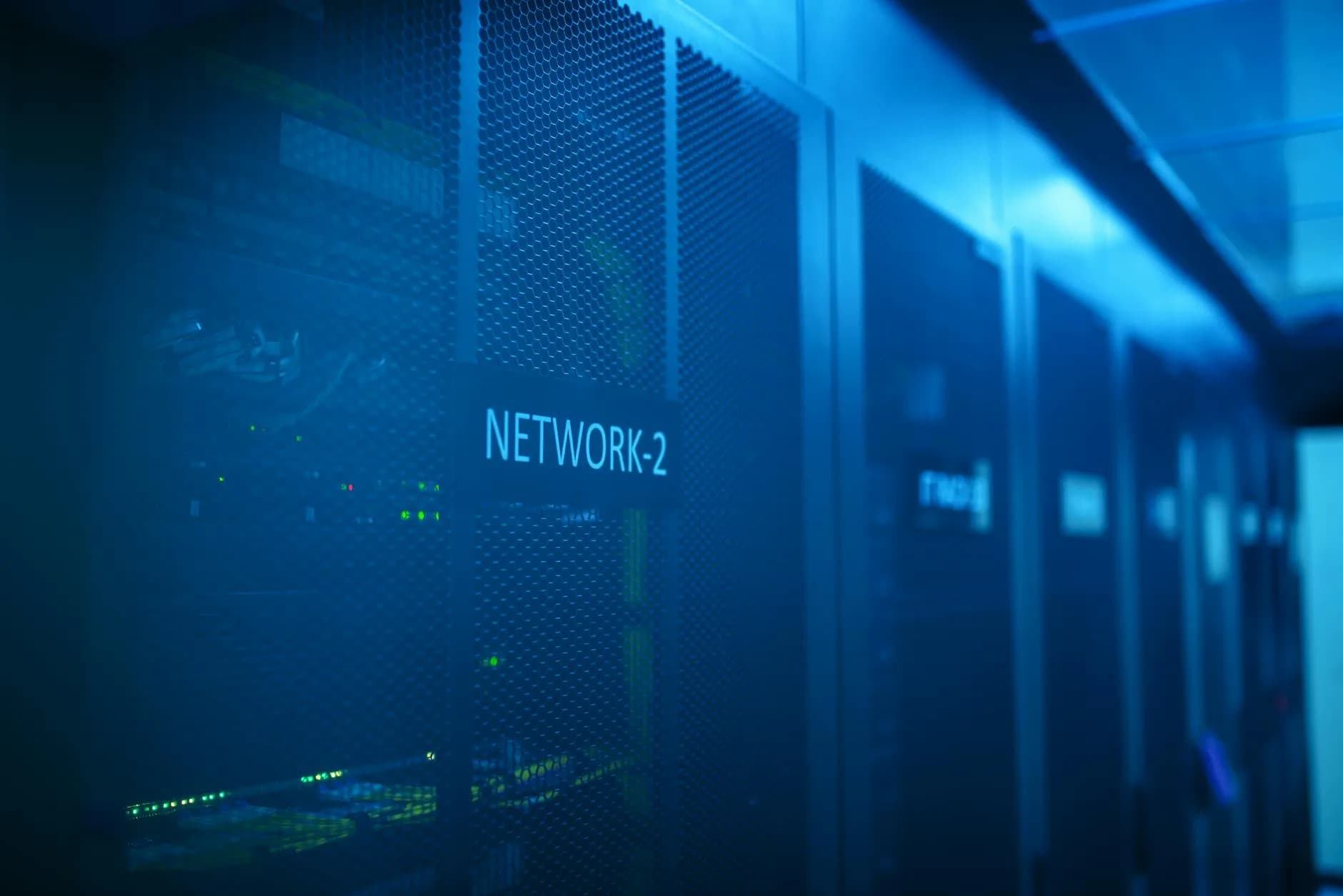 Server room with blue-lit network equipment, illustrating cloud-side transcription compute
