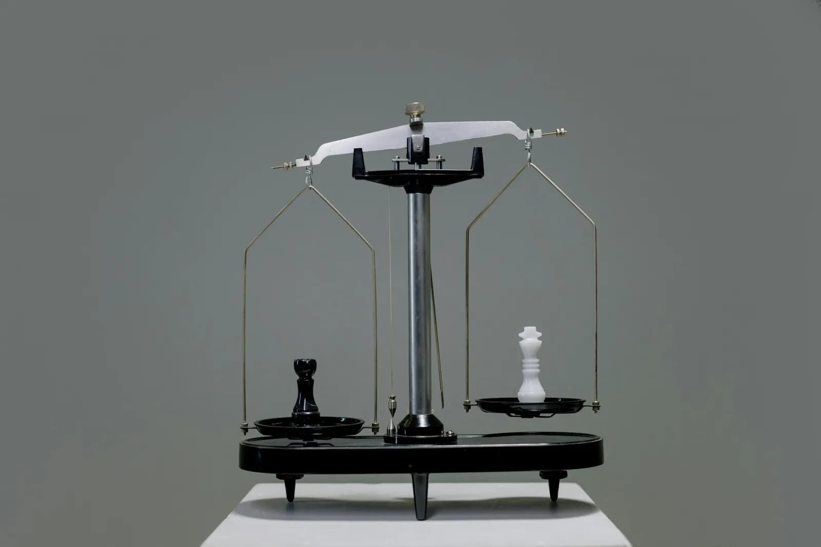 A balance scale weighing two options, illustrating when free is enough and when paying makes sense
