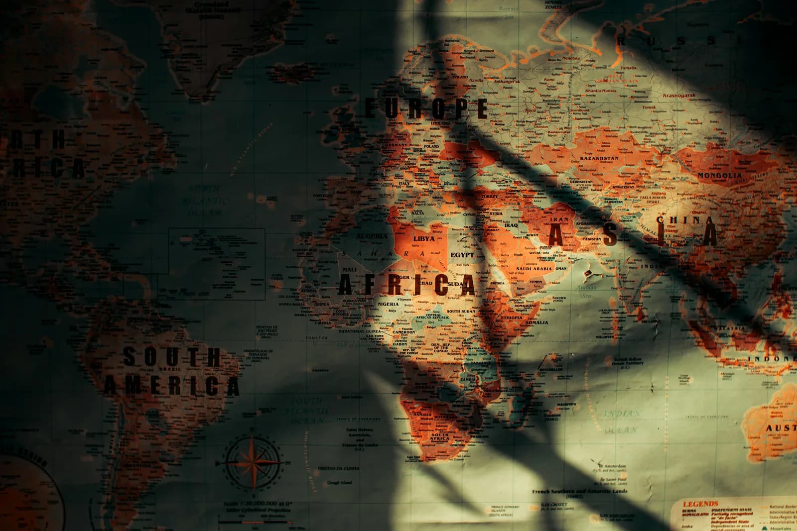 A glowing world map with light trails connecting cities, evoking many languages and fast processing