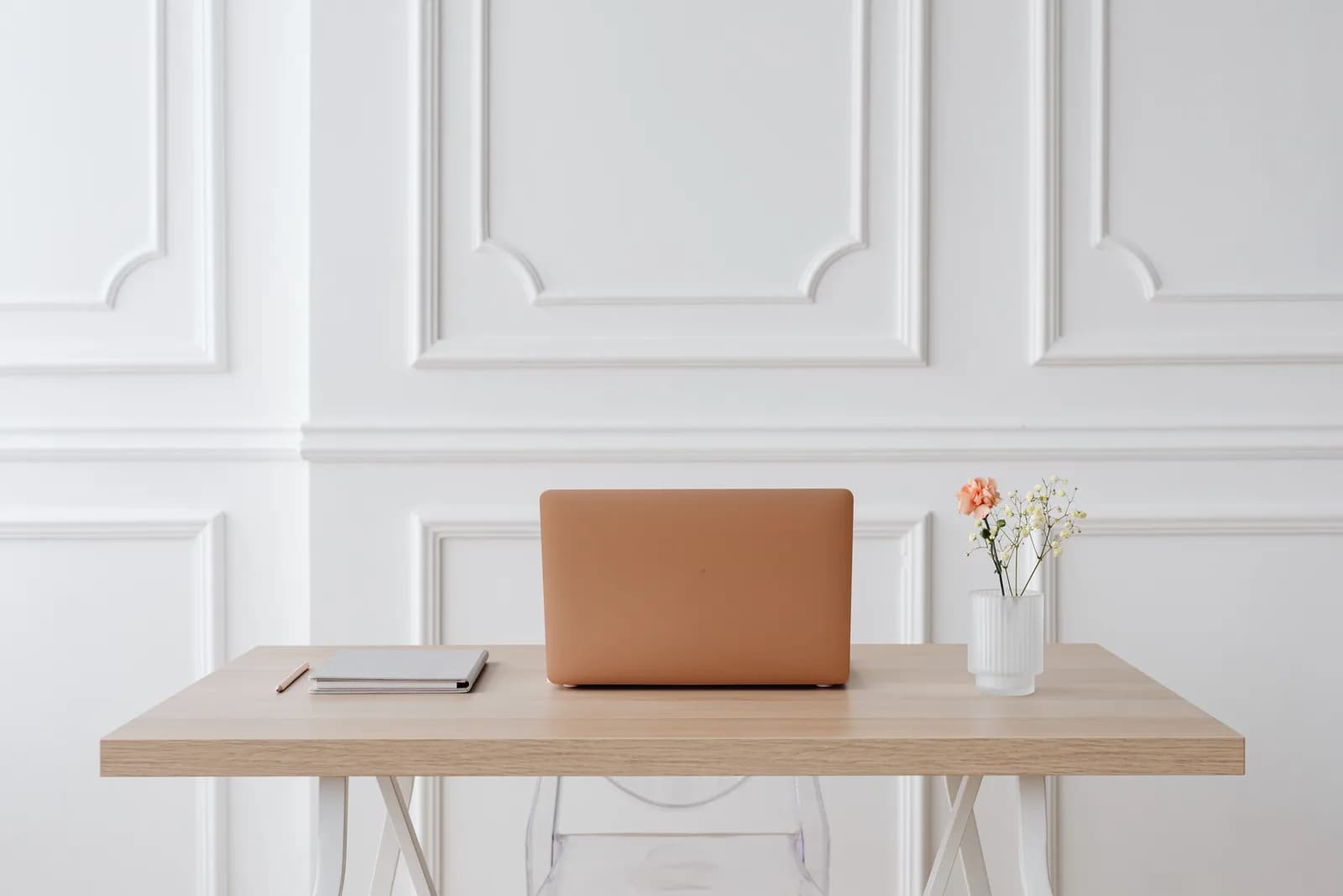 Serene simple desk with a laptop, notebook and flowers, a light no-install dictation setup