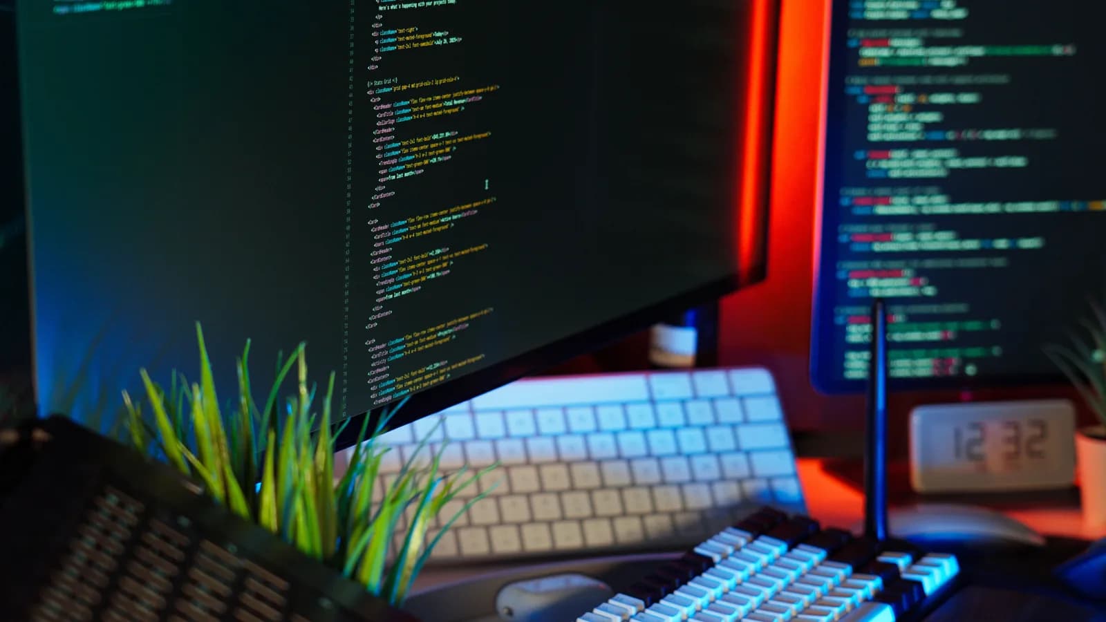 Mechanical keyboard and code on a dark desk, evoking a developer choosing between voice control and plain dictation