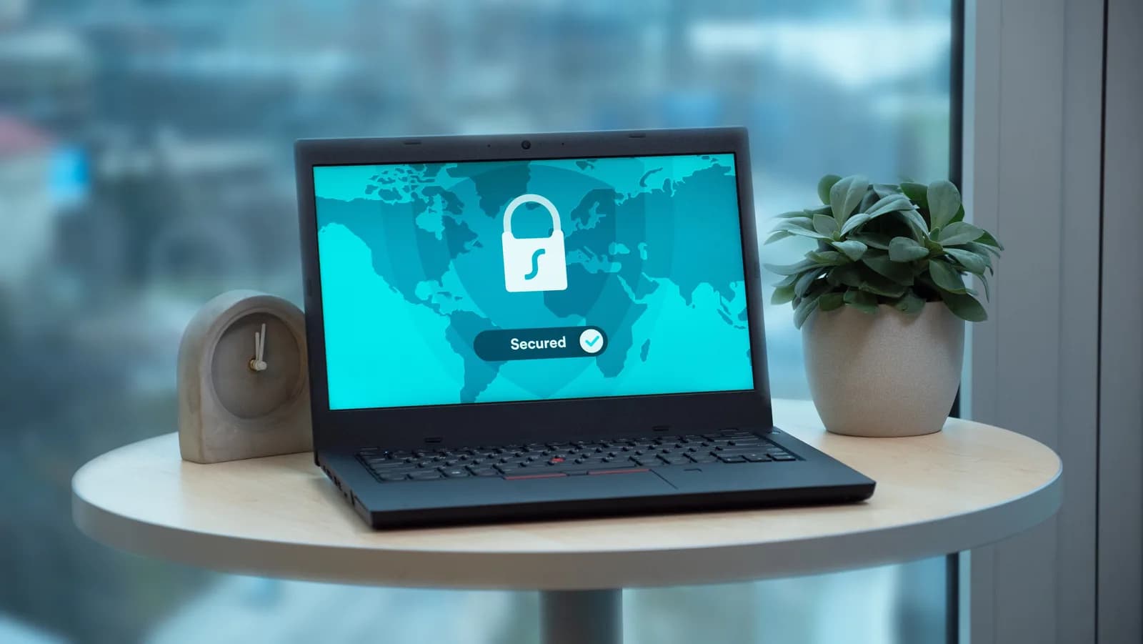 Laptop showing a security lock icon on a table, suggesting private offline processing