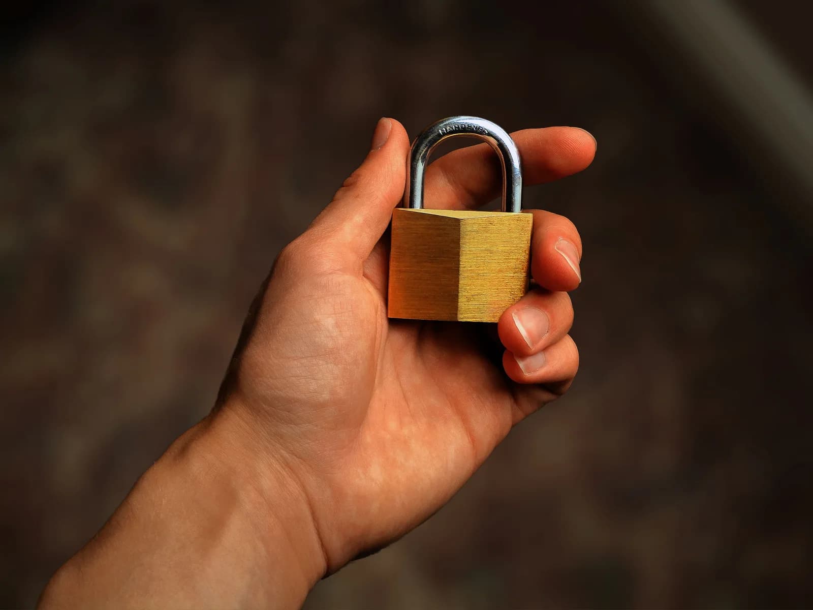 Close-up of a brass padlock, symbolizing private, on-device dictation that never leaves your machine