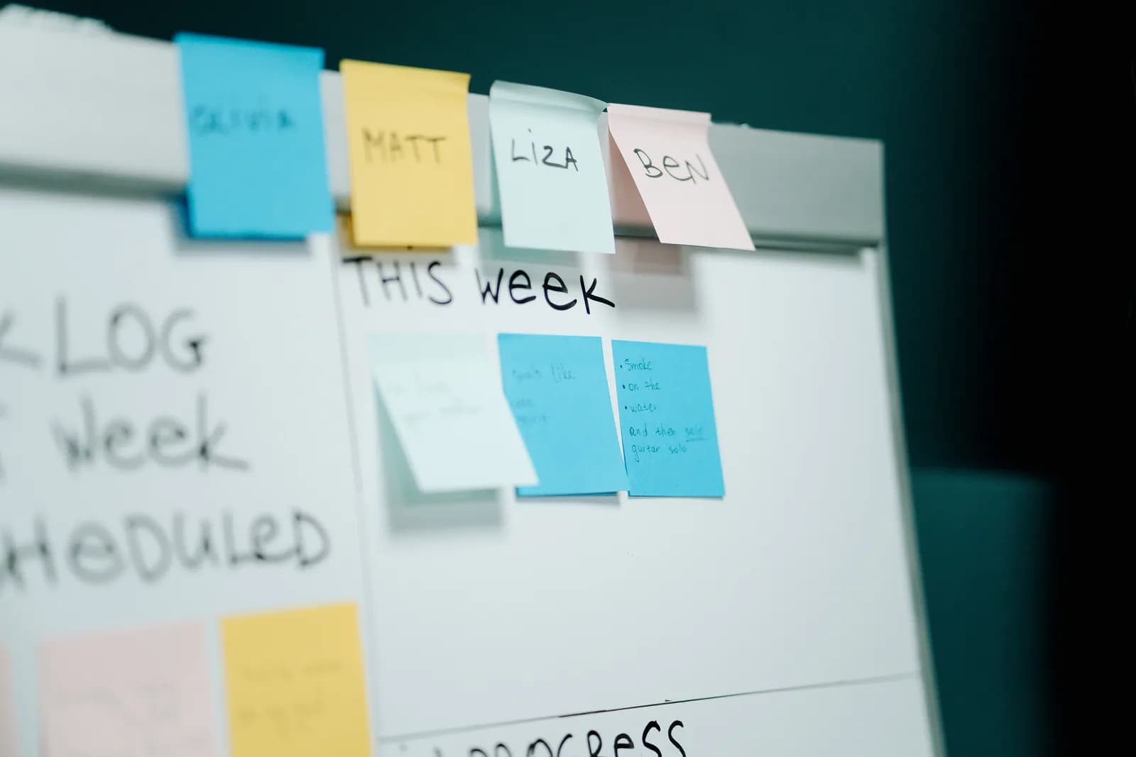 Close-up of colorful notes arranged on a board for task organization, standing in for a project tool's fields