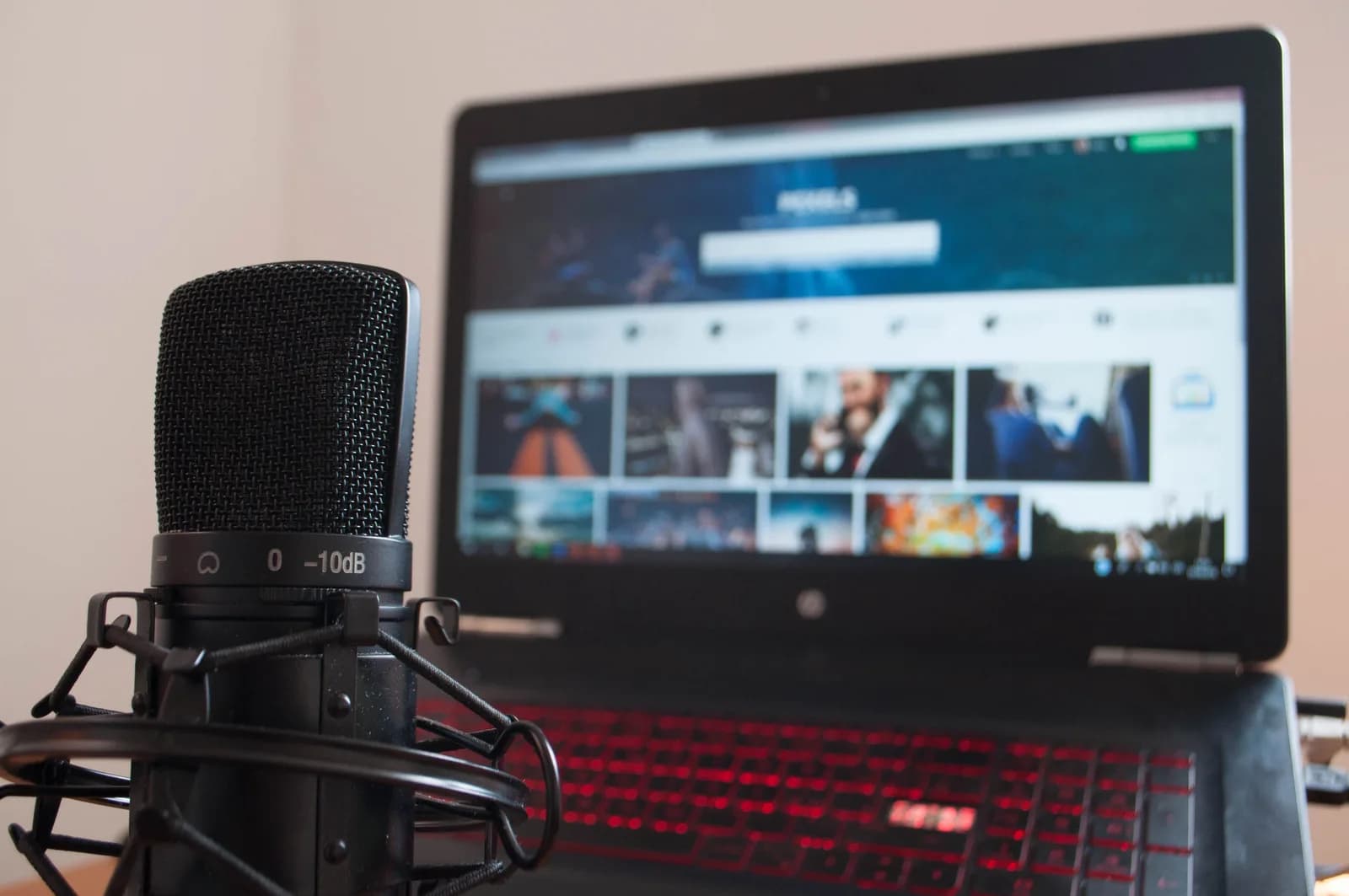 Microphone and laptop on a desk, the hardware a browser needs permission to access