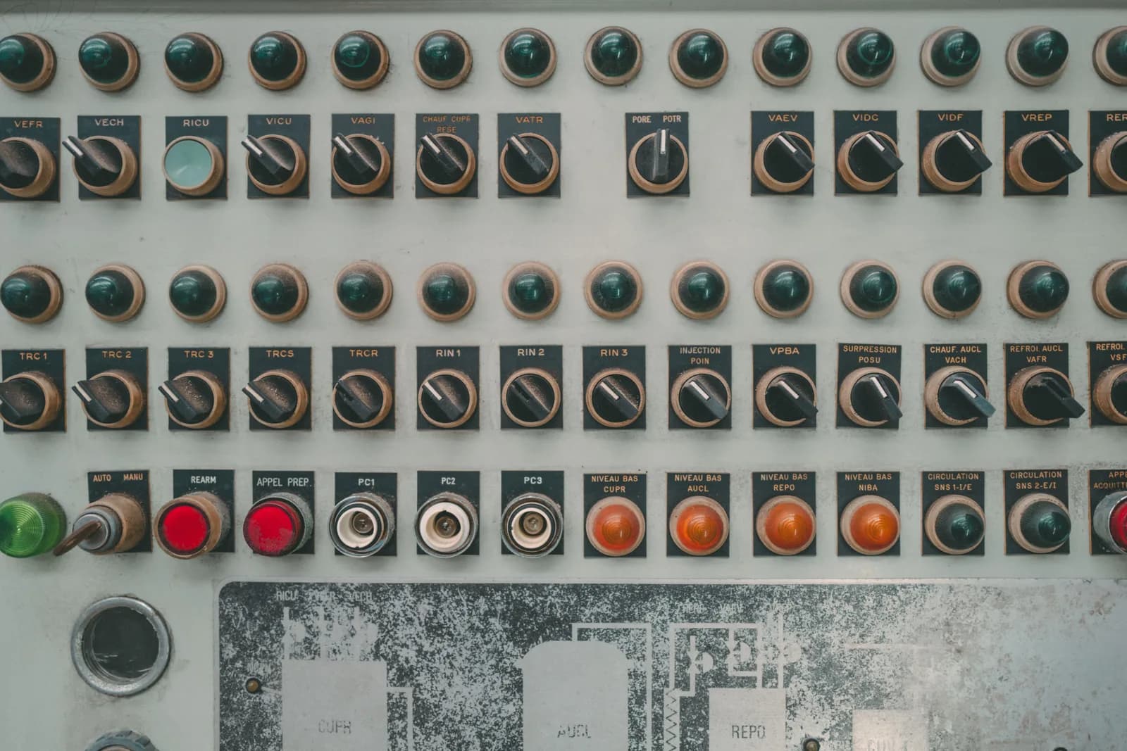 Several labelled toggle switches on a dark panel, evoking a choice between options