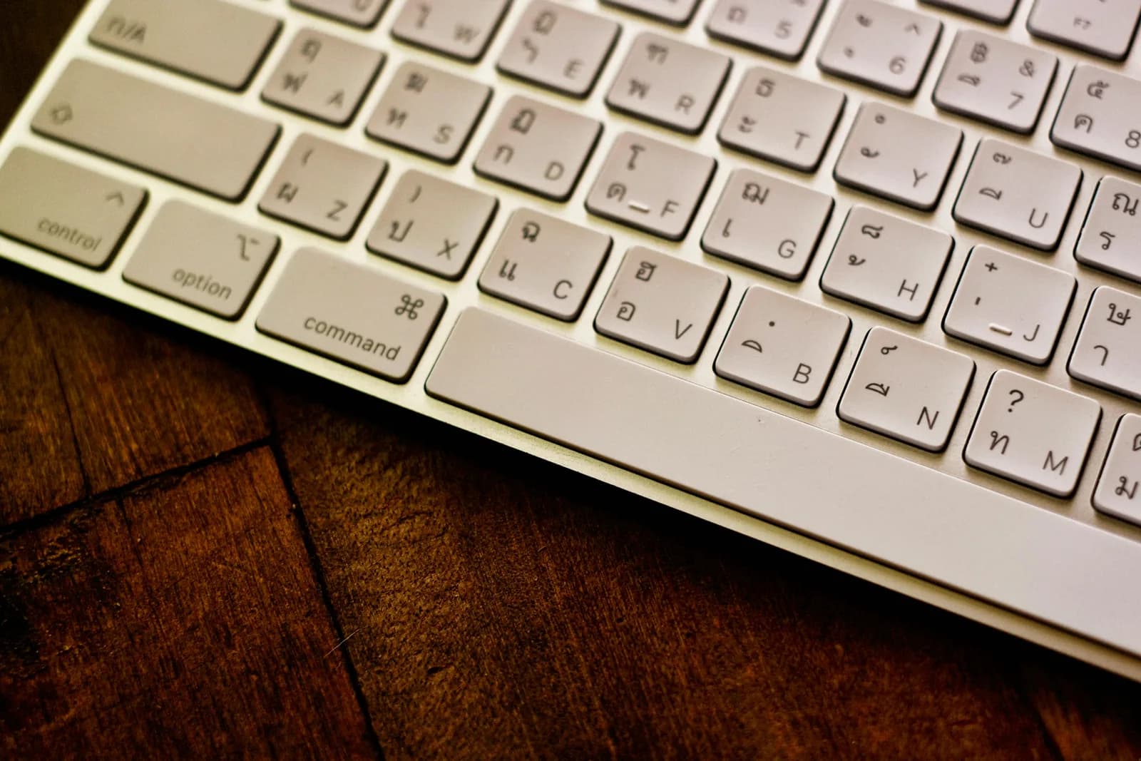 Close-up of a keyboard with non-Latin script keys, evoking installed language packs
