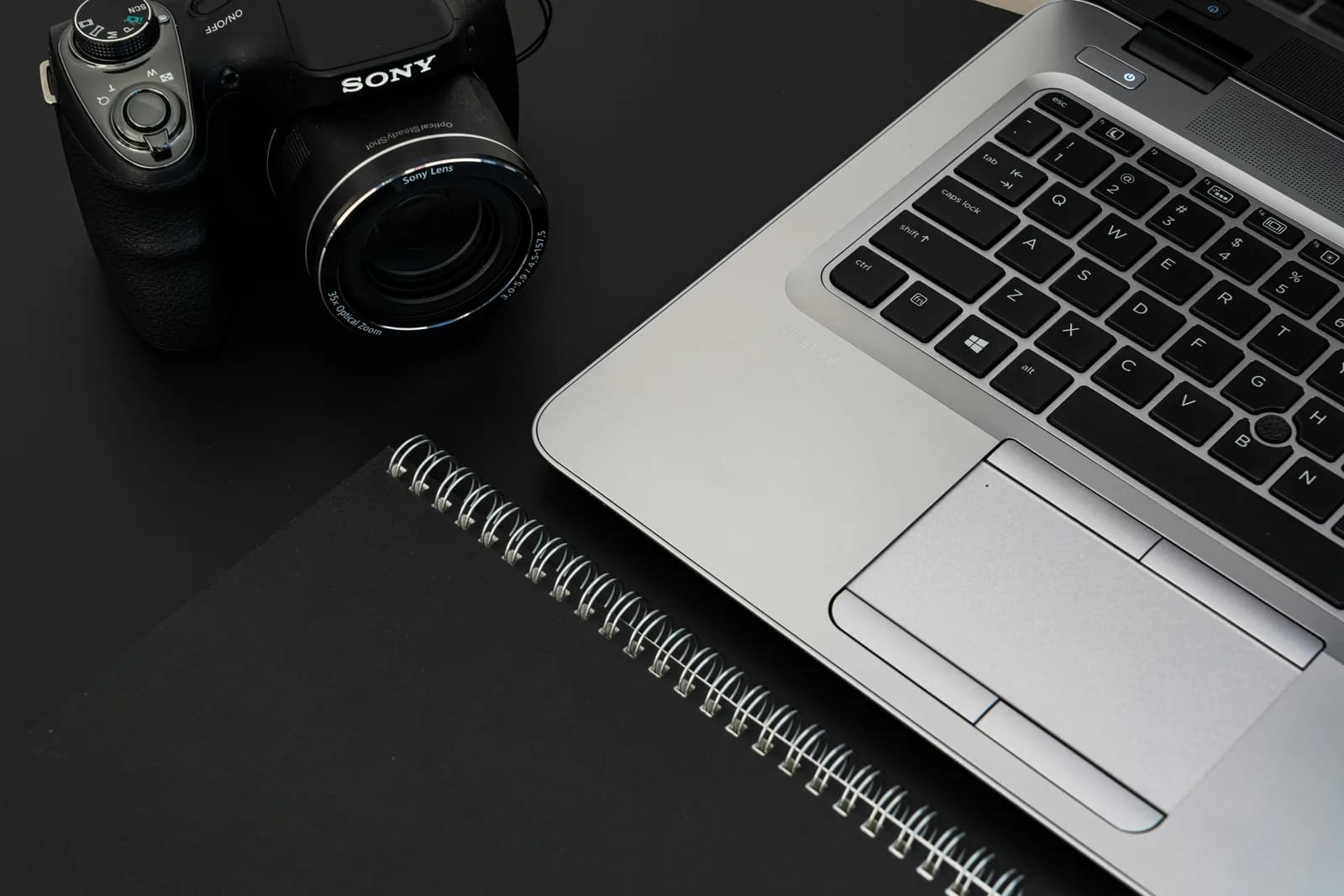 A stopwatch on a desk beside a laptop, suggesting a feature that times out mid-task, no faces in frame
