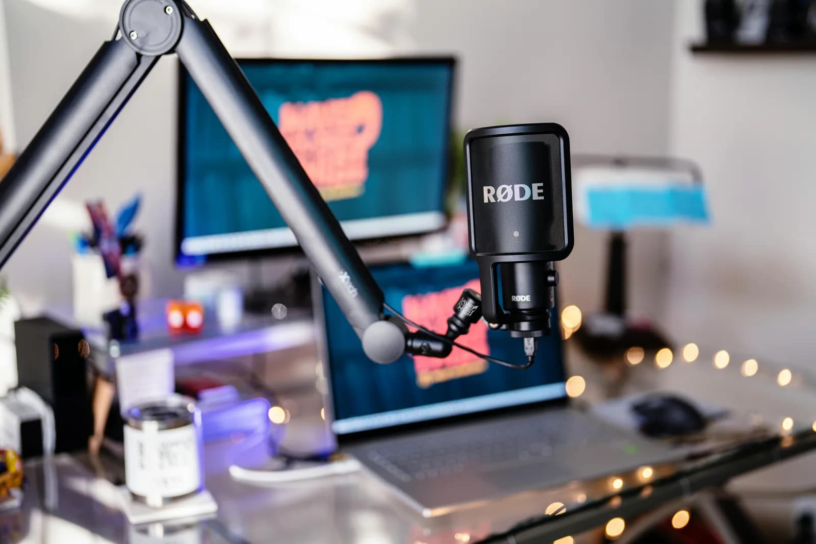 Studio microphone and digital workspace set up for recording short spoken updates
