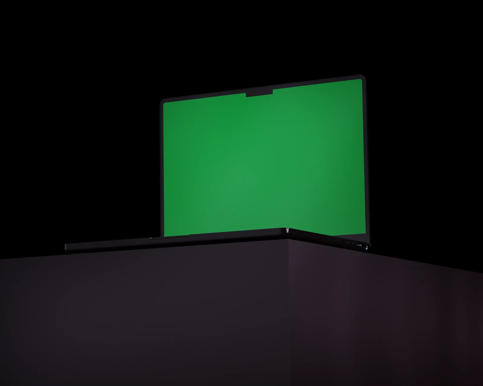 Open laptop on a minimalist black table, ready for a language pack download