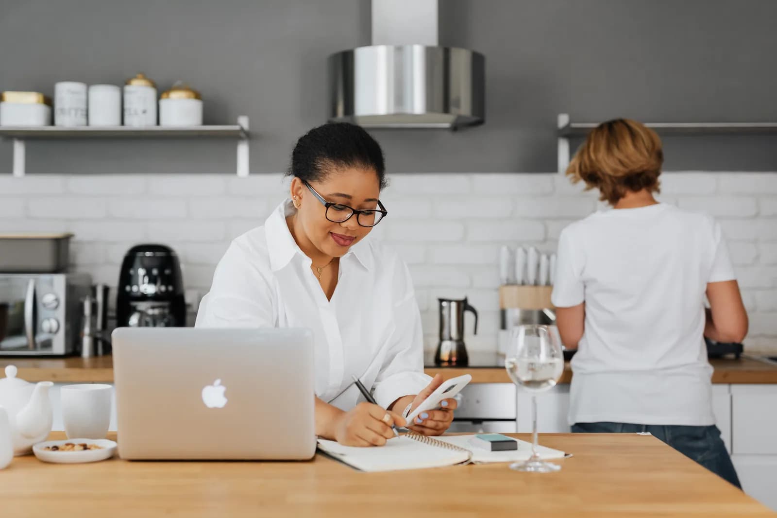 A laptop open on a kitchen counter, suggesting a quick everyday note