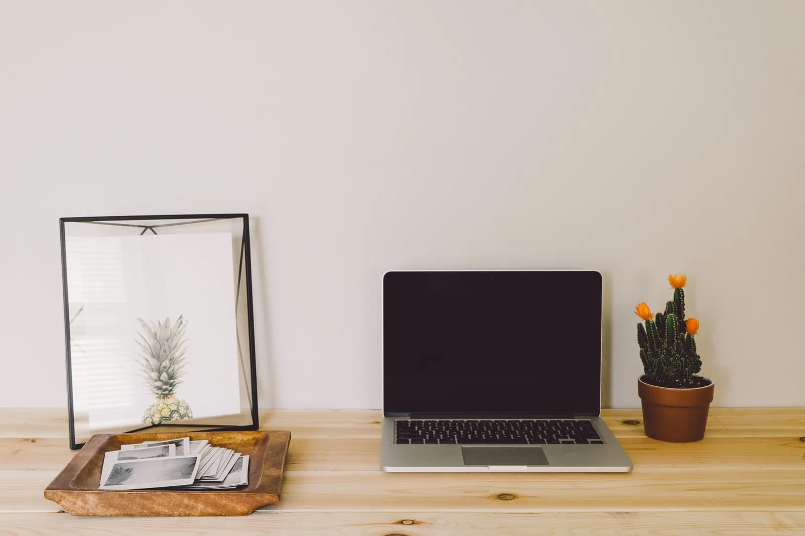 A single Mac on a clean, uncluttered desk, suggesting a simple setup that just works