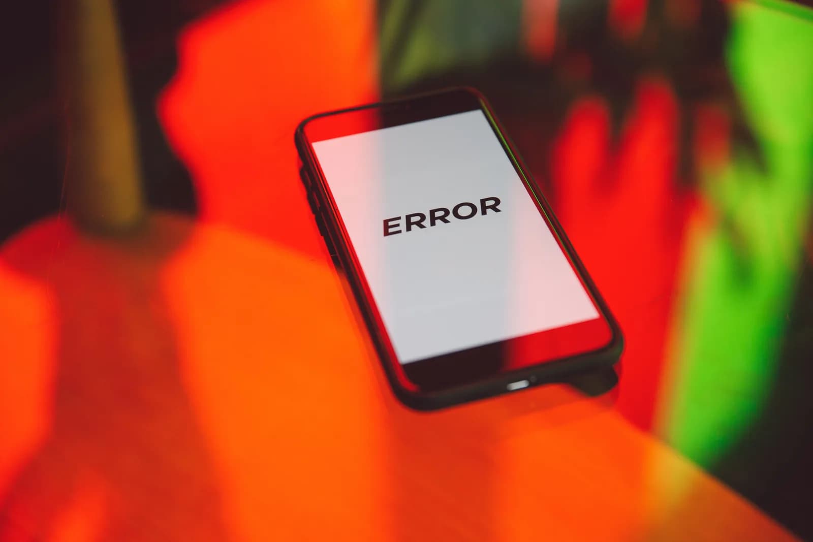 A screen showing an error message bathed in red and green light, illustrating a startup failure