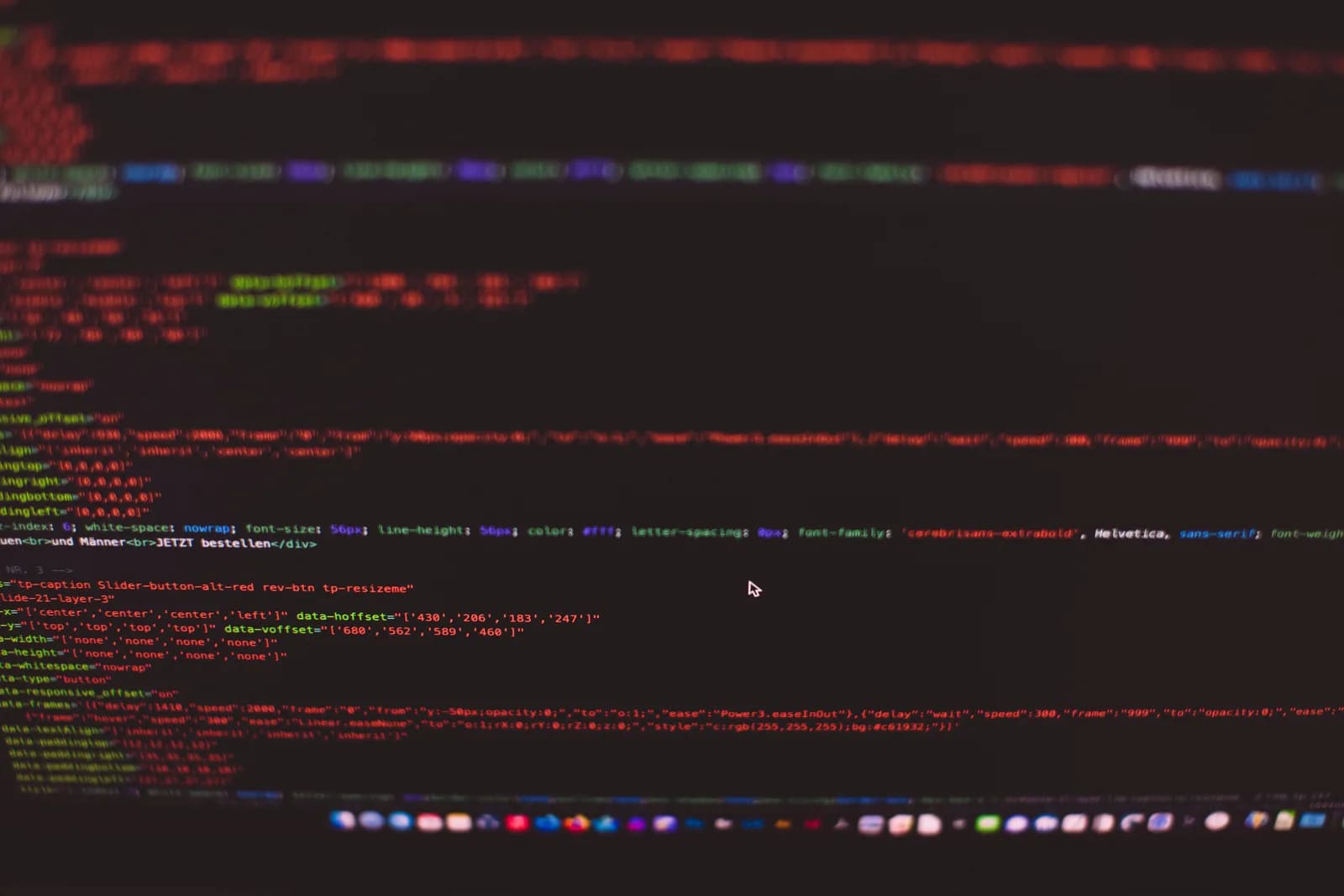 Colorful code on a dark monitor, evoking browser extensions and behind-the-scenes scripts