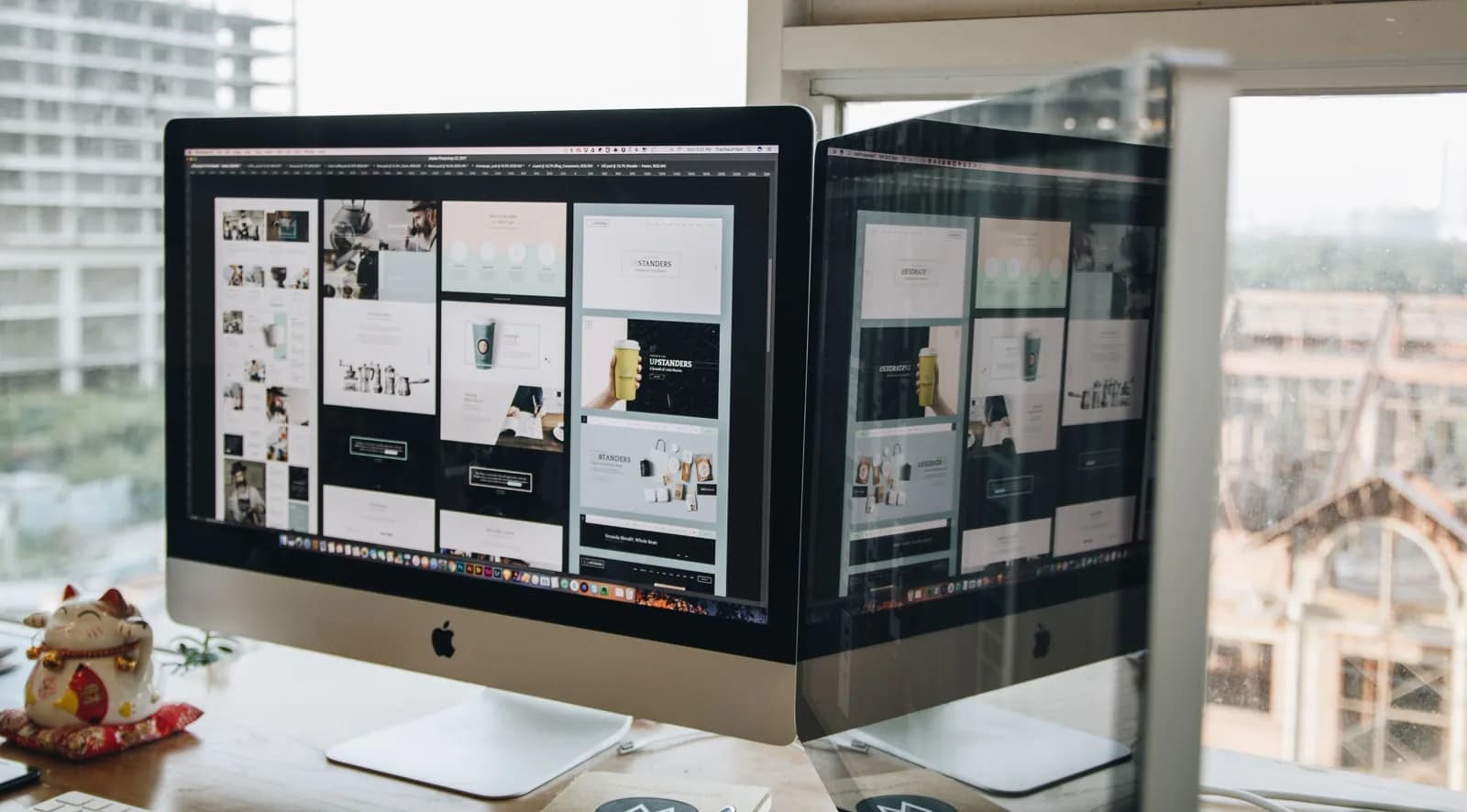 Dual monitors on a desk showing open windows, illustrating how the active window holds dictation focus